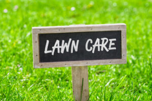 "Lawn Care" sign on green lawn-OKC lawn care services-Watson's Weed Control